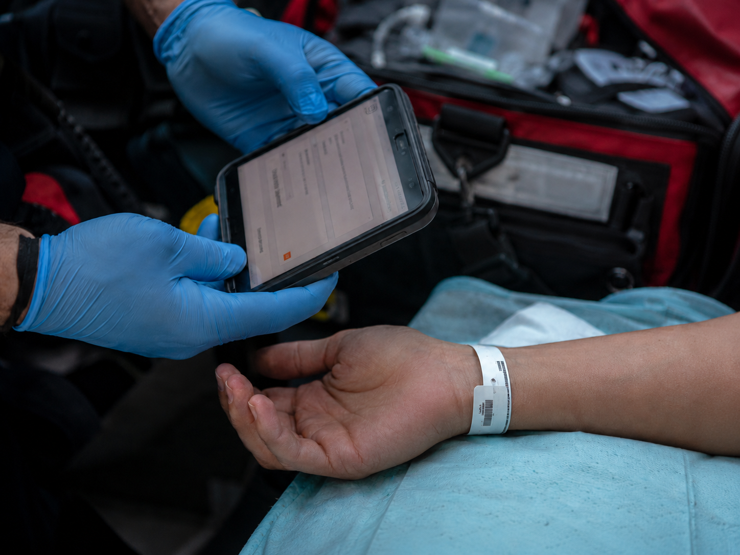 EMT reading the manifest of someone unconscious.